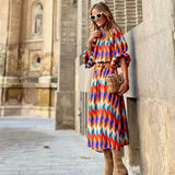 Cassandra - Vibrante Geometrische Kleid